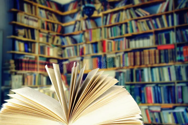 A bookshelf organized by color